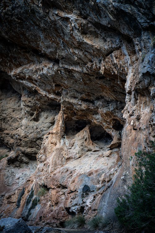 Free Explore the rugged beauty of a limestone cave featuring intricate geological formations. Stock Photo