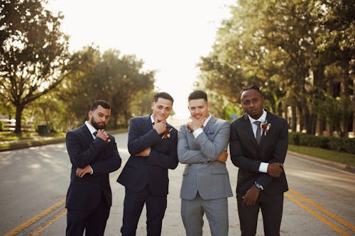 Men in Suits Posing on Road