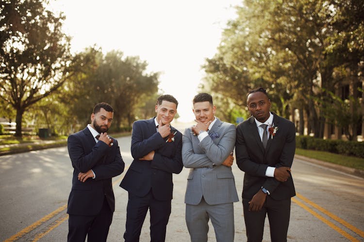 Men In Suits Posing On Road