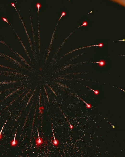 Stunning fireworks explosion captured at night in Puebla, Mexico, showcasing vibrant colors and motion.