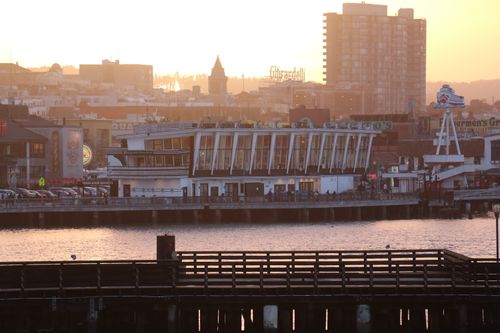 Free Sunset view of Fisherman's Wharf with cityscape and waterfront in San Francisco. Stock Photo