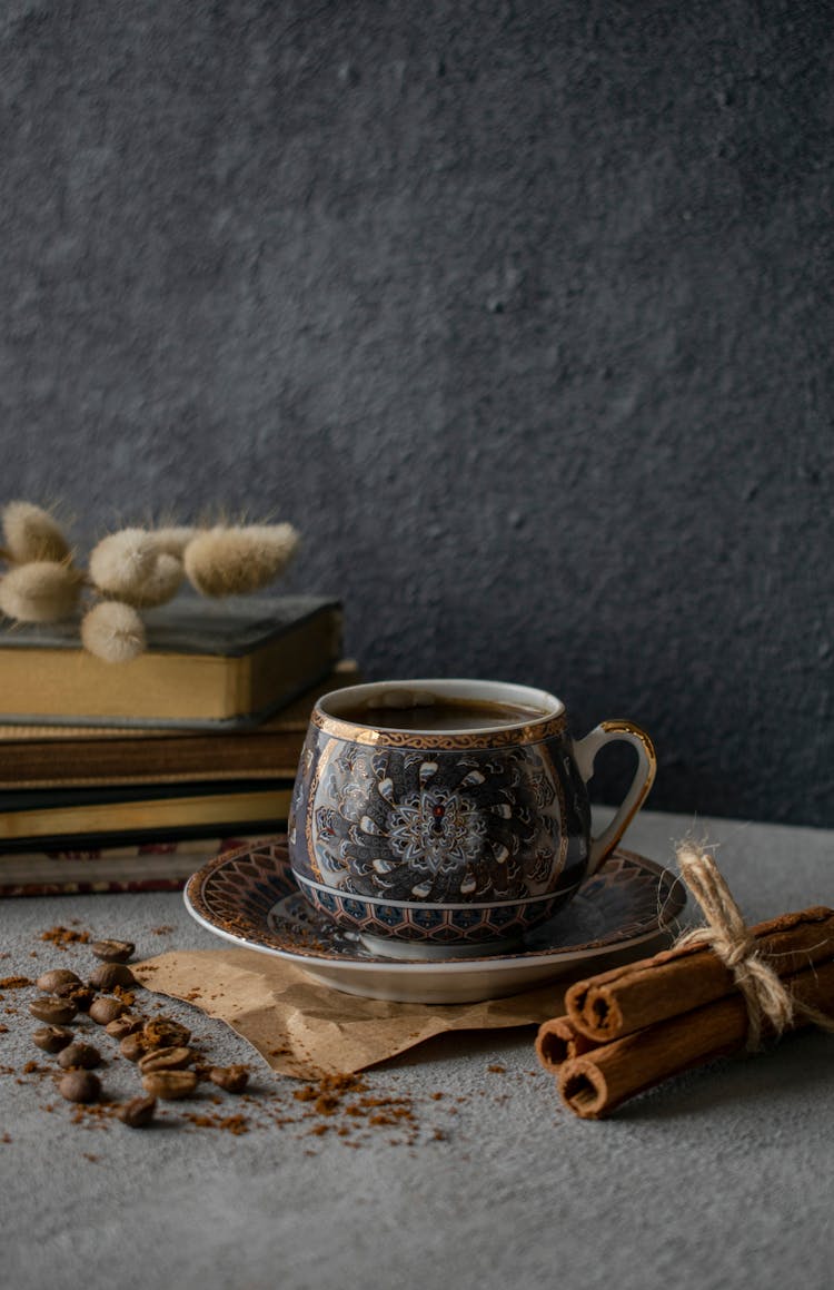 Coffee In Cup And Spices On Table