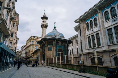 Free Historic Hobyar Mosque with people walking in urban Istanbul, Turkey. Stock Photo