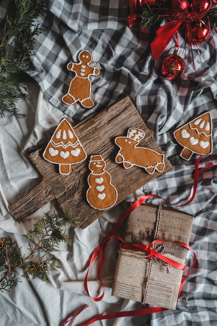 Wrapped Gift And Gingerbreads On The Table At Christmas