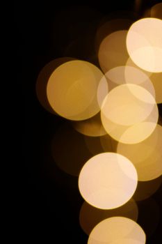 Blurry circular bokeh lights creating a warm and abstract visual effect.