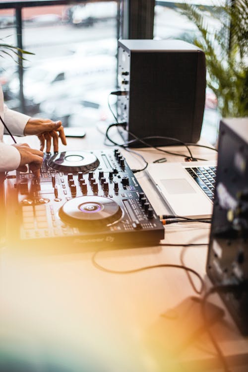 Free Foto Person Holding Dj Controller Stock Photo