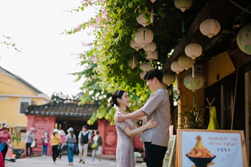 Man and Woman Standing in Front of Each Other