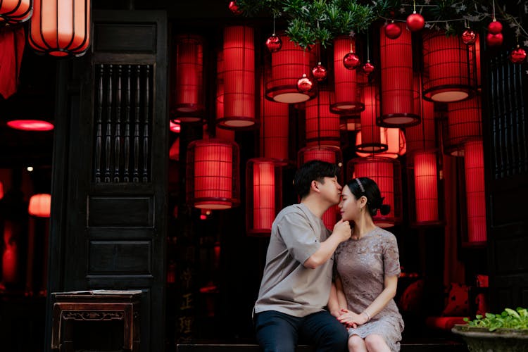 A Man Kissing The Woman's Forehead 