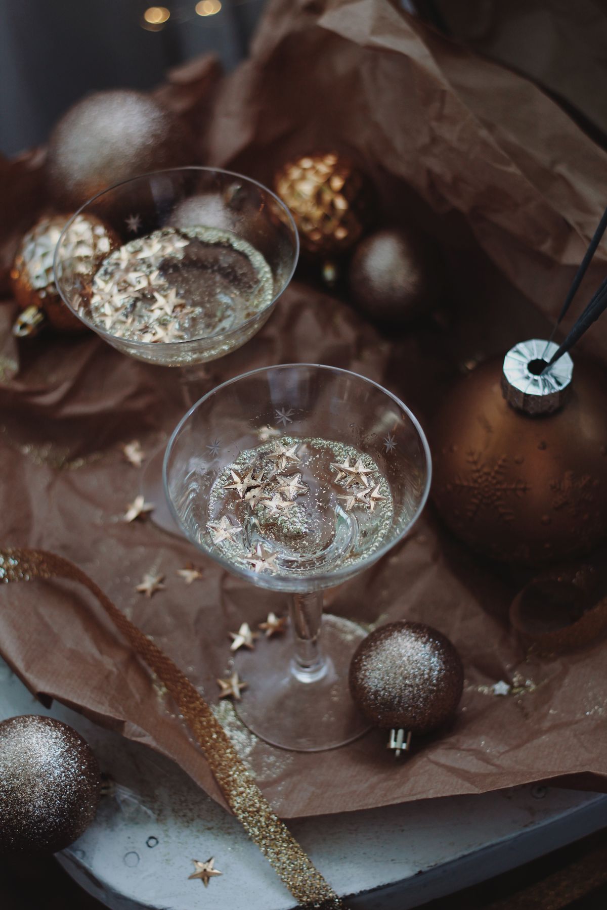 Champagne flutes with star decorations for a holiday toast