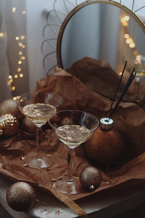 Champagne Glasses with Glitter on Table by Mirror