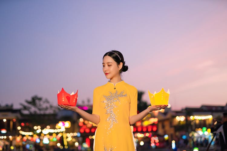 Photograph Of A Woman Holding Lanterns