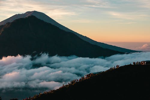 View of Mountains above Clouds at Sunset