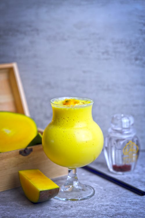 Clear Cocktail Glass with Yellow Liquid · Free Stock Photo