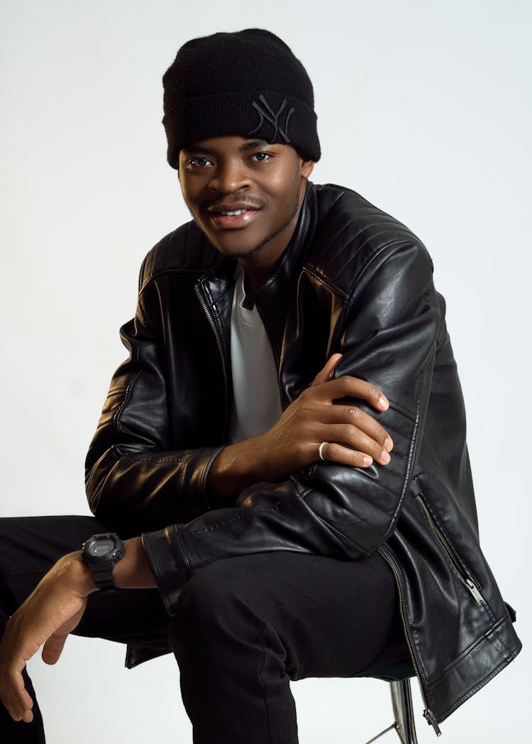 Man In Black Leather Jacket And Bonnet Smiling