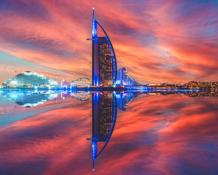 Red Sky Over Illuminated Burj Al Arab In Dubai