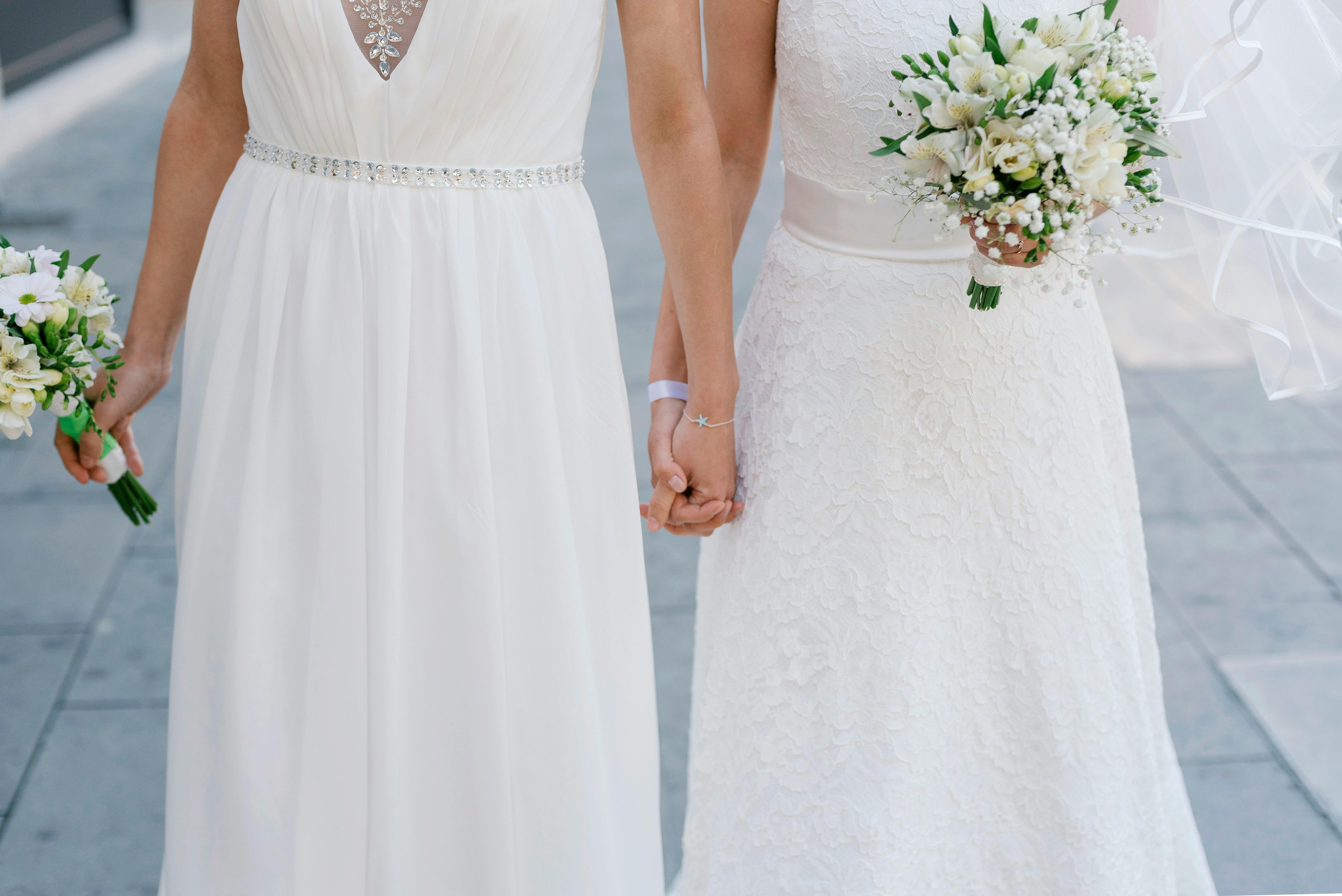 middle section shot of two brides