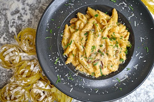 Free A plate of pasta with cheese and parmesan Stock Photo