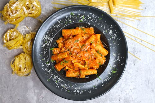 Free A plate of pasta with sauce and spaghetti Stock Photo