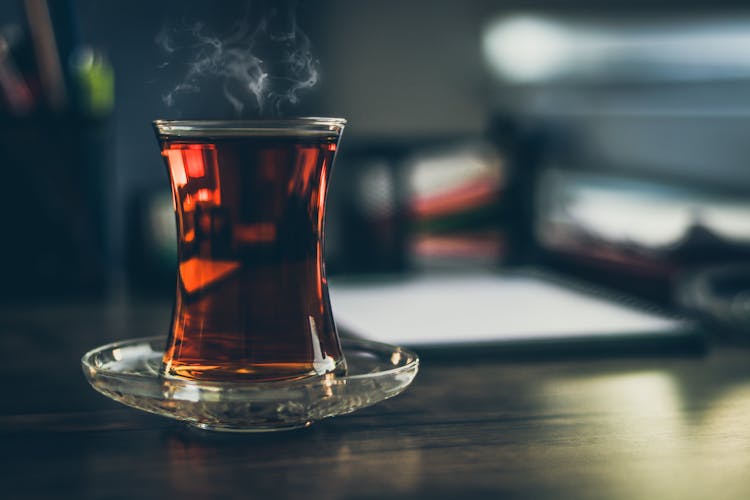 Close-up Photo Of Steaming Black Tea In Glass