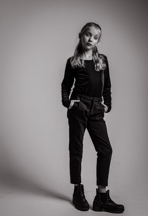 Grayscale Photography of Girl in Long-sleeved Top and Jeans Outfit