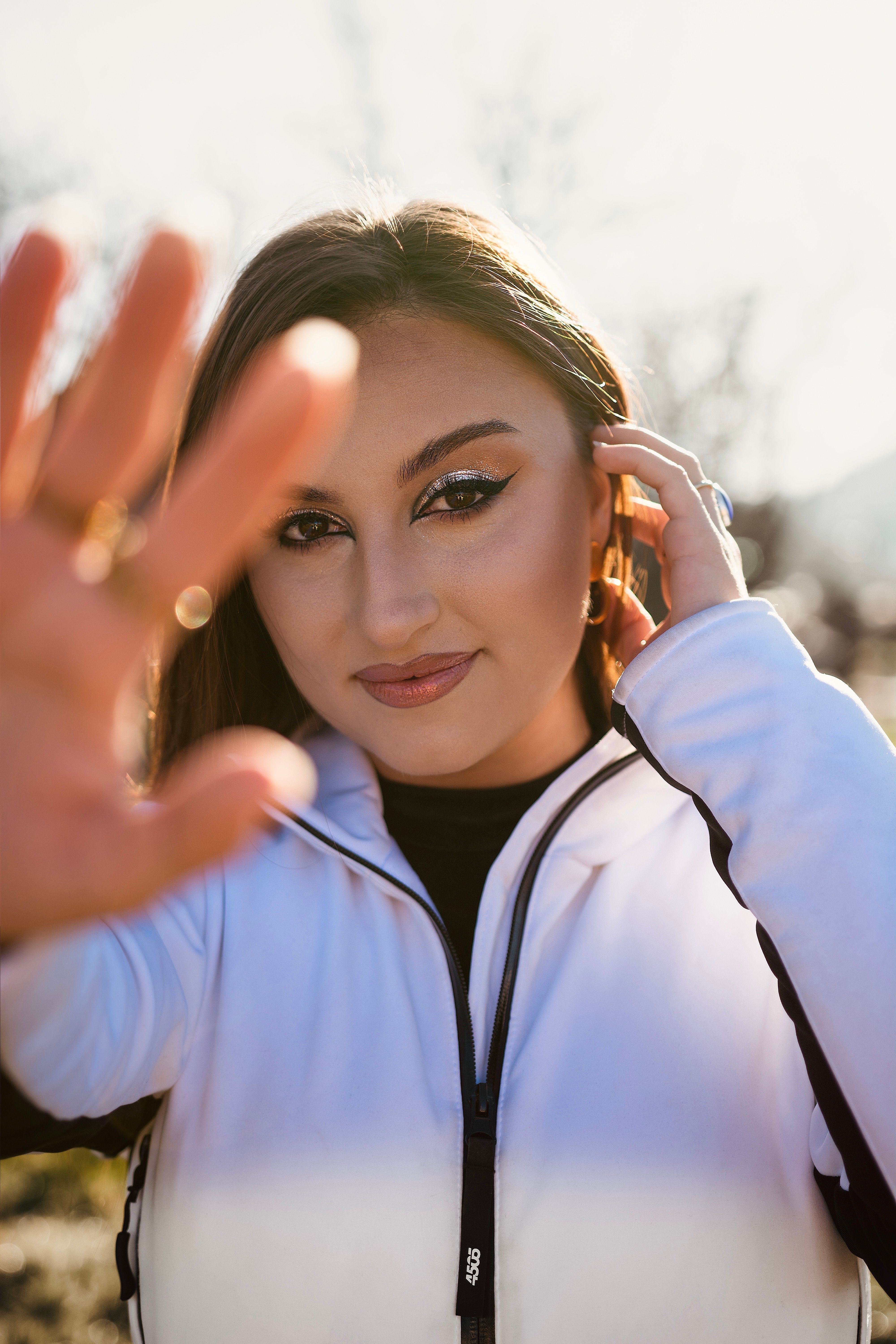 A Woman in White Jacket Smiling at the Camera · Free Stock Photo