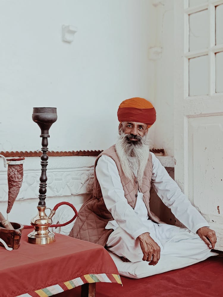 Old Bearded Man In Traditional Headwear And Clothing 