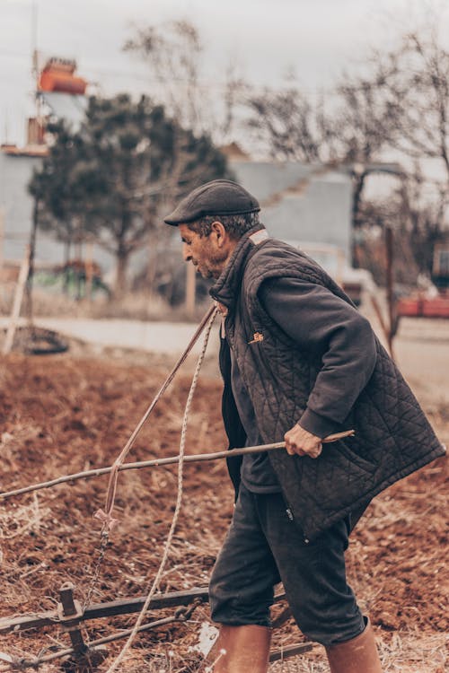 Farmer Working on Field