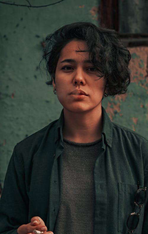 Close Up Photo of Woman Smoking Cigarette