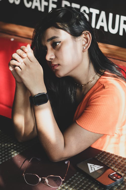 Pensive Woman Wearing Smartwatch
