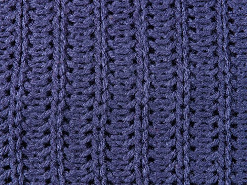 Close-up Photo of Blue Knitted Textile 