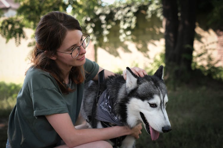 A Woman Holding Her Dog