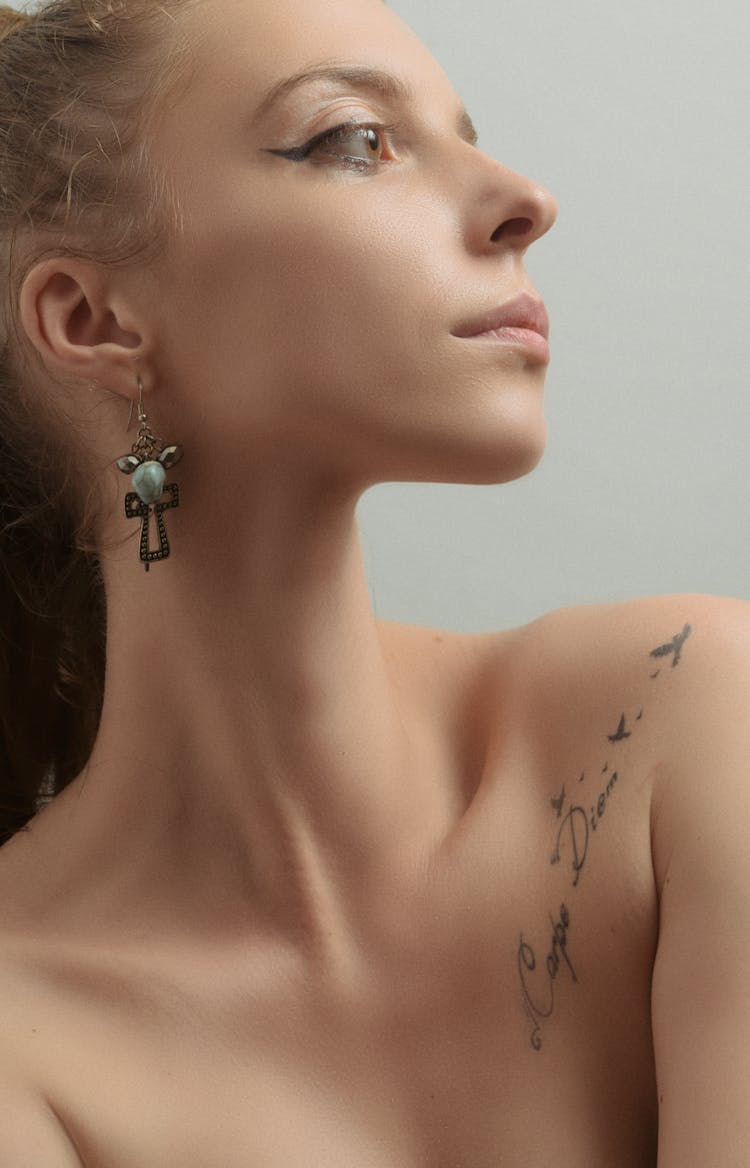 Woman With Tattoo And Earring