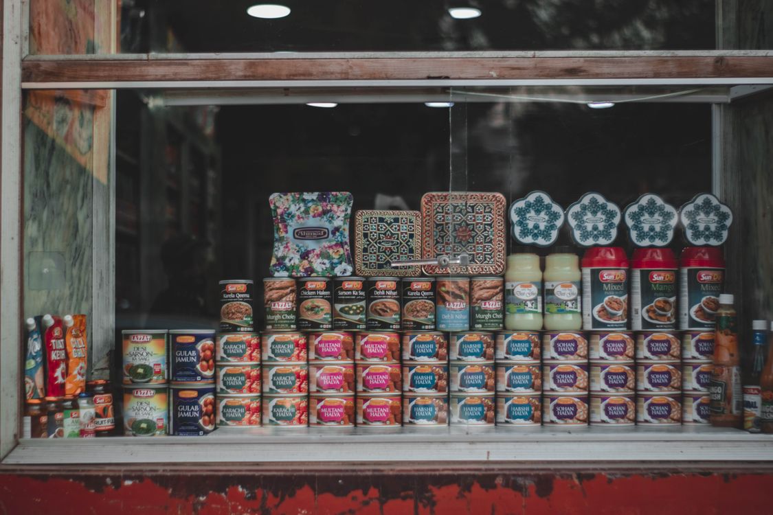 Food Cans in Shop Showcase · Free Stock Photo