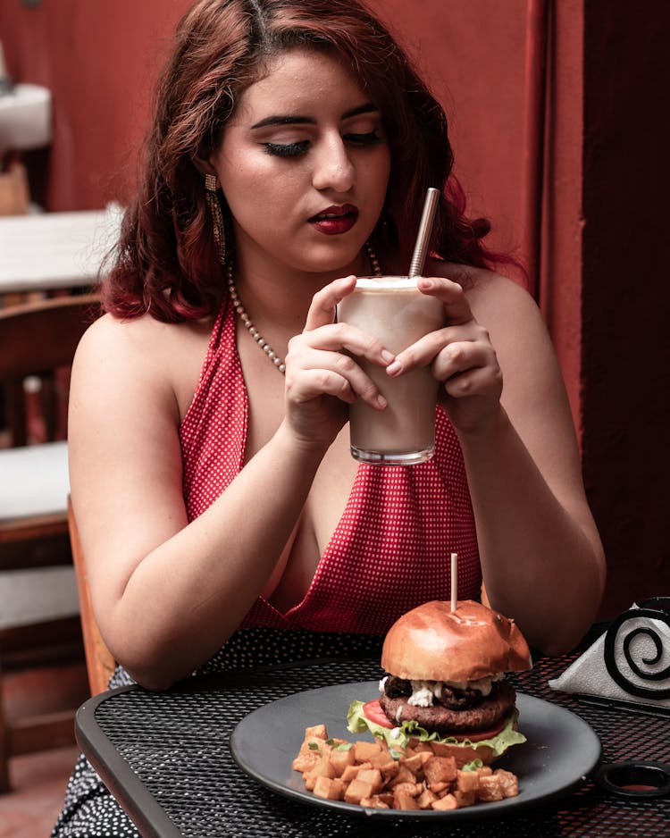 Woman Eating In Restaurant