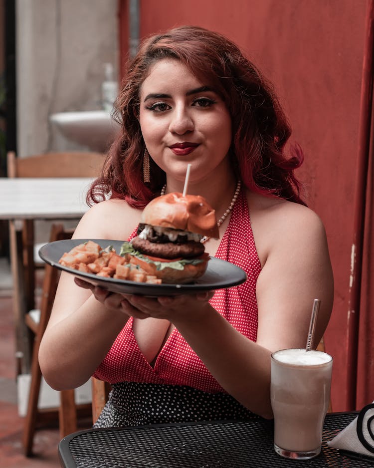 Woman Eating In Restaurant