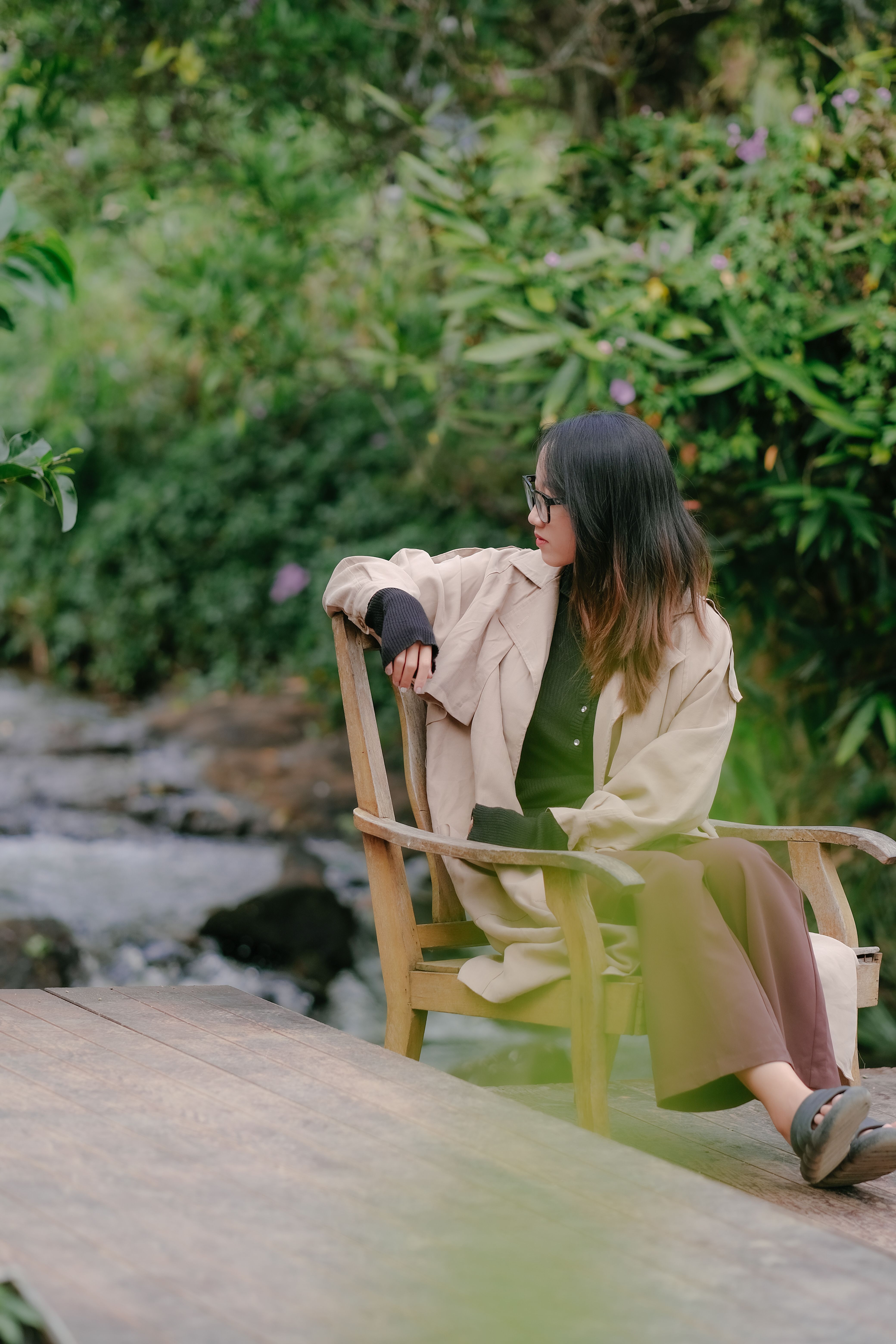Girl Sitting on Chair near Water in Nature · Free Stock Photo