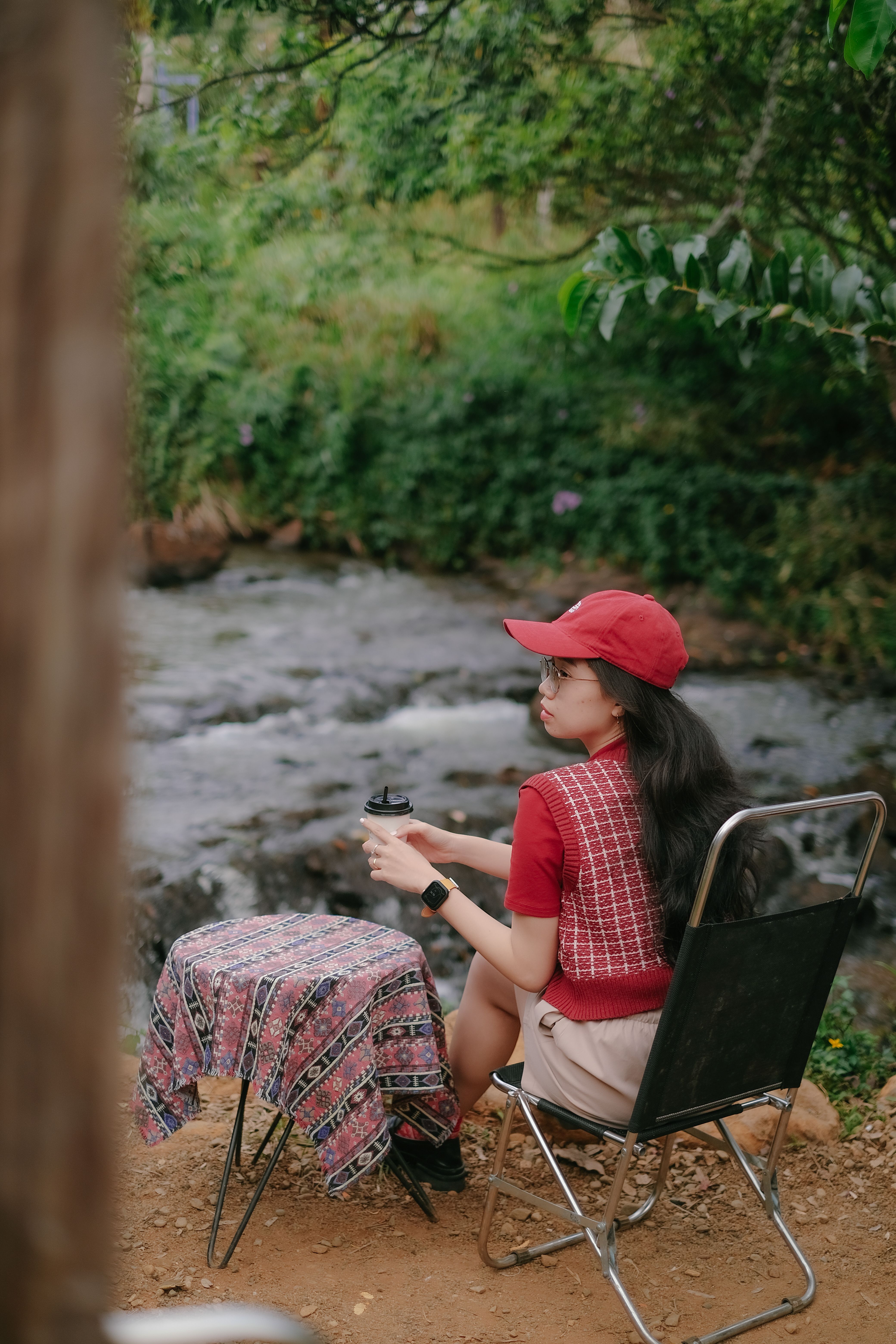 Girl Sitting on Chair near Water in Nature · Free Stock Photo