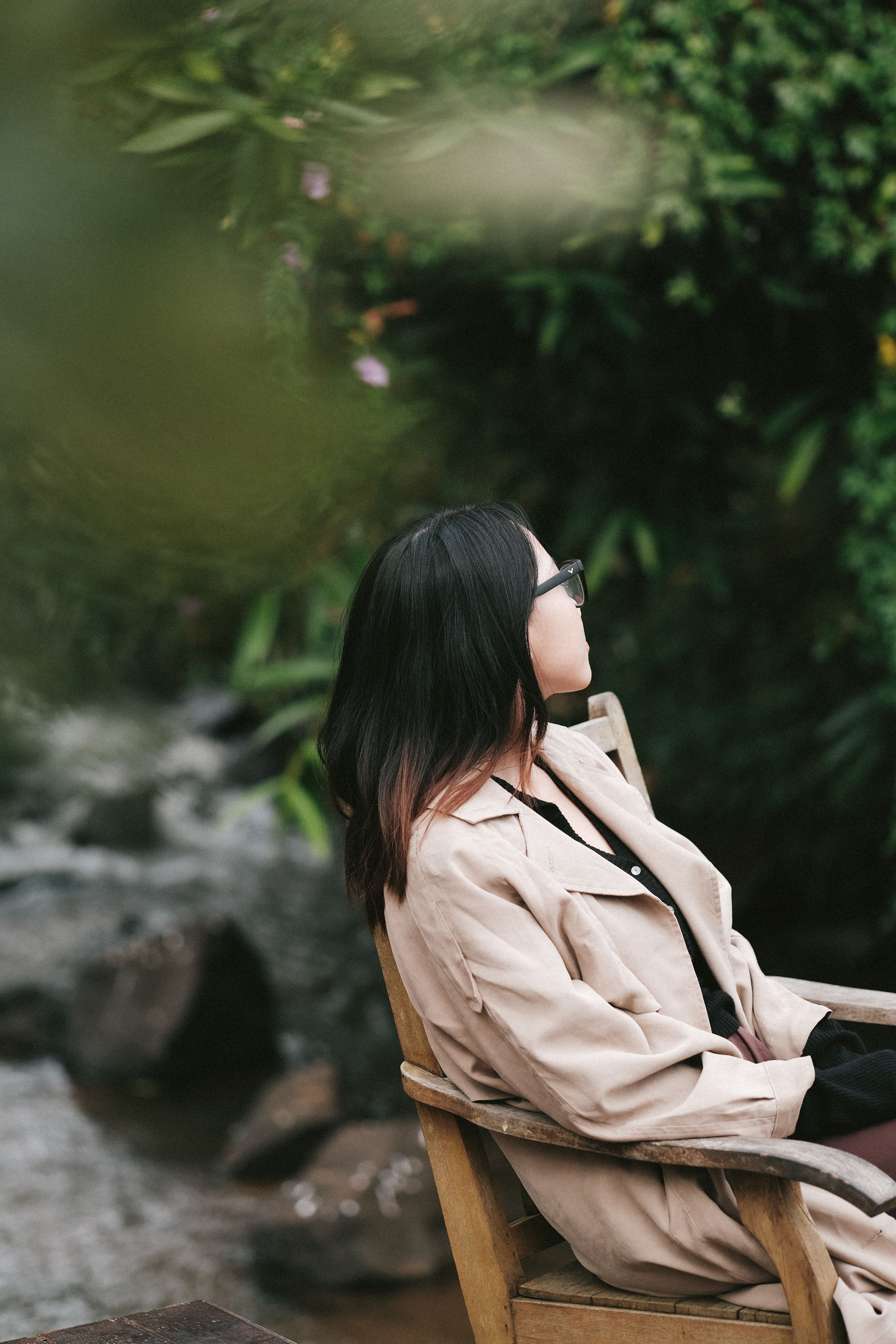 Girl Sitting on Chair near Water in Nature · Free Stock Photo