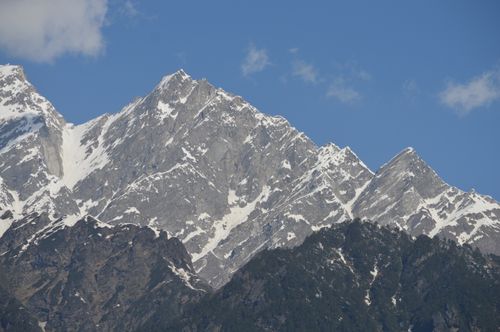 Free A breathtaking view of a snow-capped mountain range under a clear blue sky, showcasing nature's grandeur. Stock Photo