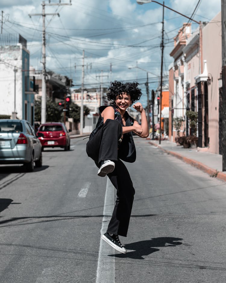 Woman Dancing On City Street