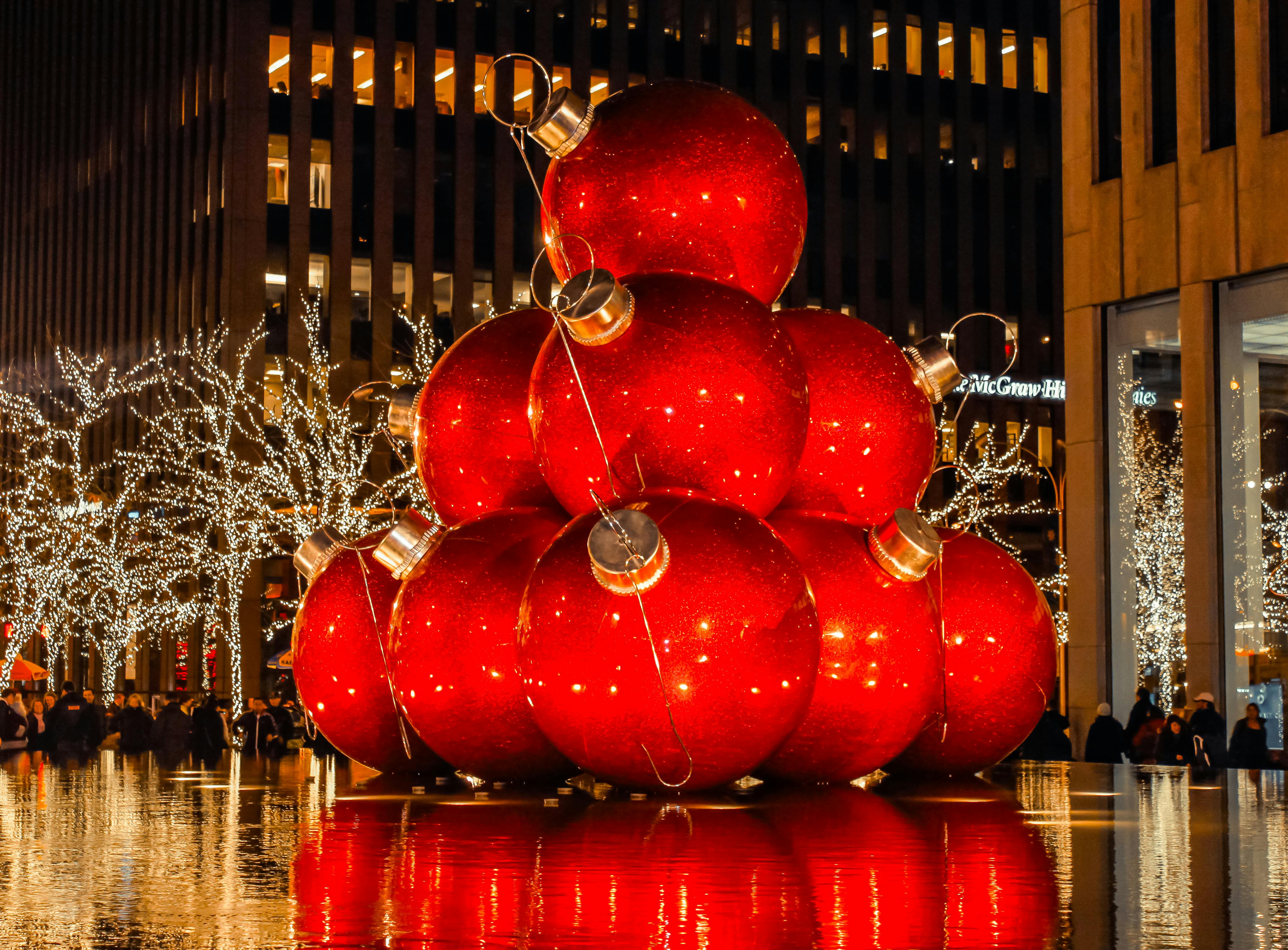 Free Giant Christmas Balls on Display over Water Fountain Stock Photo