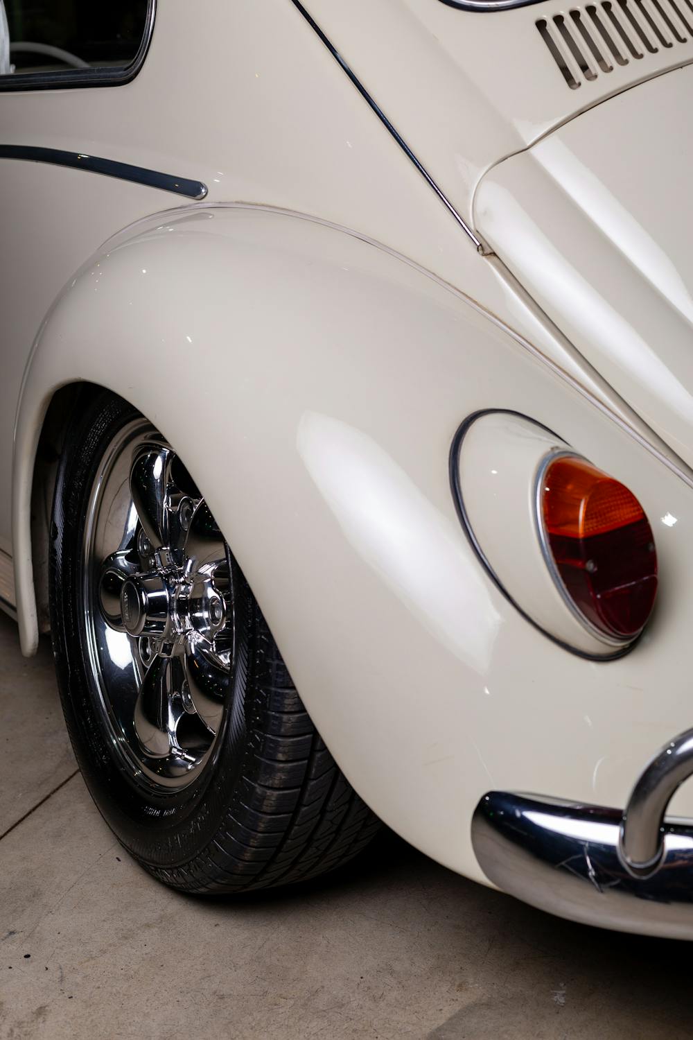Close Up Photo of White Classic Car with Chrome Rim · Free Stock Photo