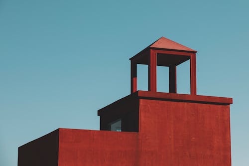 Clear Sky over Red Building Wall