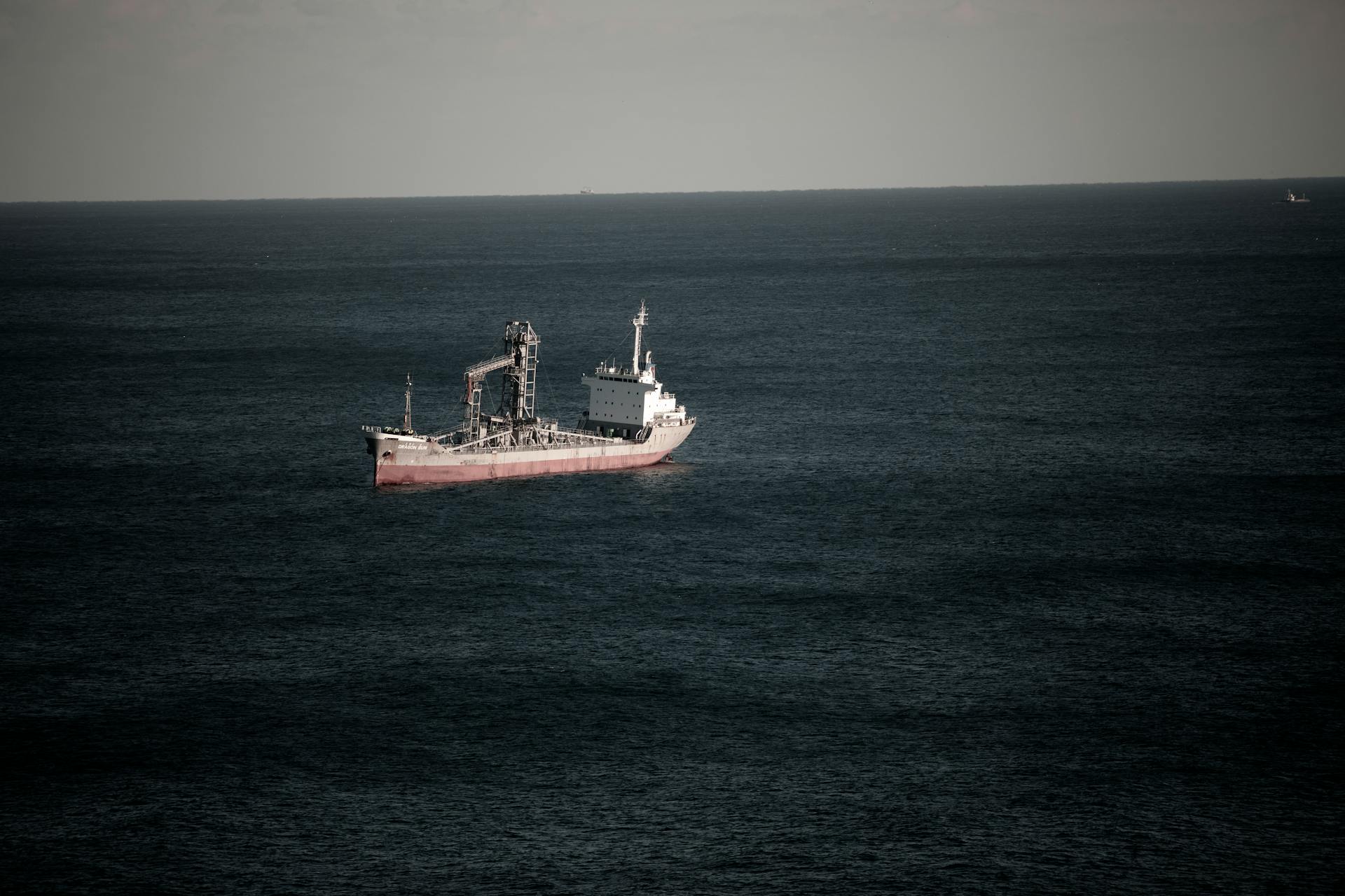 Cargo ship navigating in the tranquil waters off the coast of Donghae-si, South Korea.