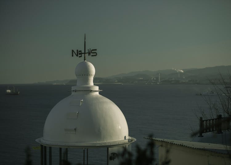 Wind Vane On Top Of A Dome Roof