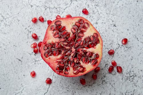 Pomegranate on Marble Surface 