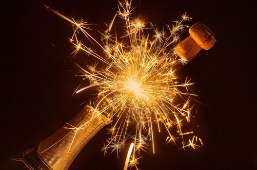 Celebrate with a champagne explosion and sparklers. Perfect for New Year or party scenes.