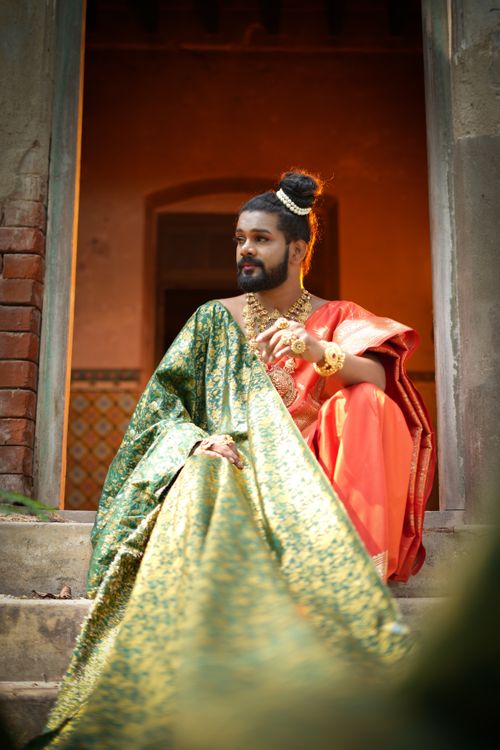 Free A portrait of an Indian man in traditional clothing and jewelry, posing gracefully. Stock Photo