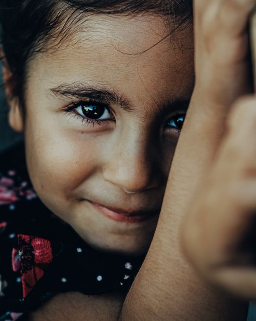 Free Beautiful close-up portrait of a young girl smiling warmly, captured in Turkey. Stock Photo