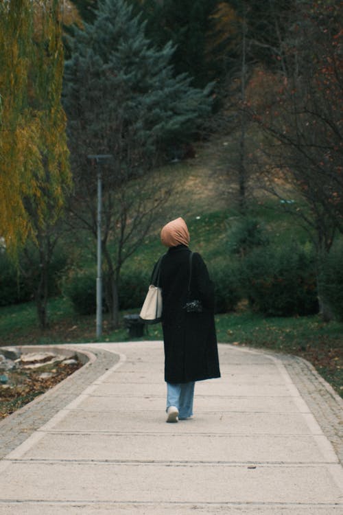 Woman in Coat and Headscarf